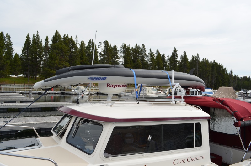 The rack is desined to keep the kayak parallel to the boat.  By doing so the stern does not wear on the bimini, nor does the kayak act like a parachute and catch the wind.