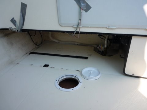 the second rubber strip the tank was sitting on had slid out a while ago reinstalled with contact cement. The front one (shown) stayed in place.