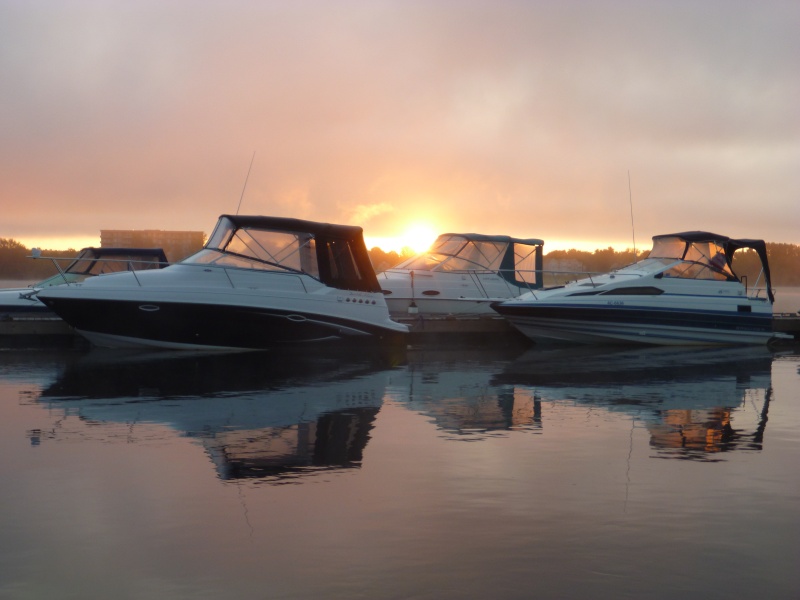 The sun coming up on the Saint John river at the St Regis Wharf Marina in Fredericton