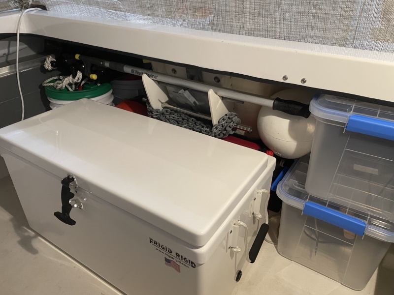 the whole thing goes behind the cooler tucked away but at the ready? makes a handy spot for the boat hook.