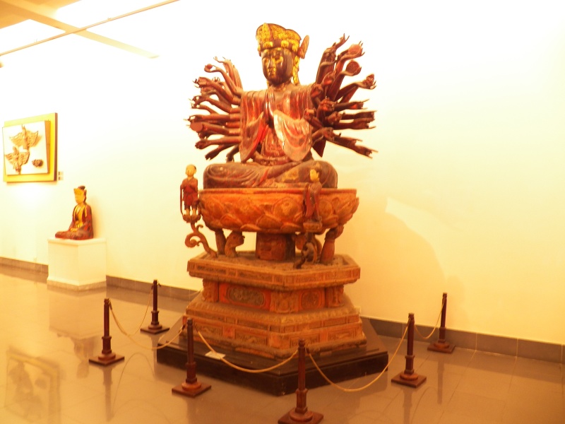Then this old lady came out and yelled at me.  This is actually my bad photo of Quan Yin, a female iteration (bodhisattva) of the Buddha in the National Museum in Hanoi.  She is flanked by her two little helpers.