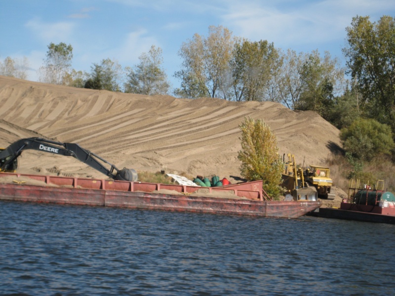 These huge sandy islands created by dredging pop up all over the river.