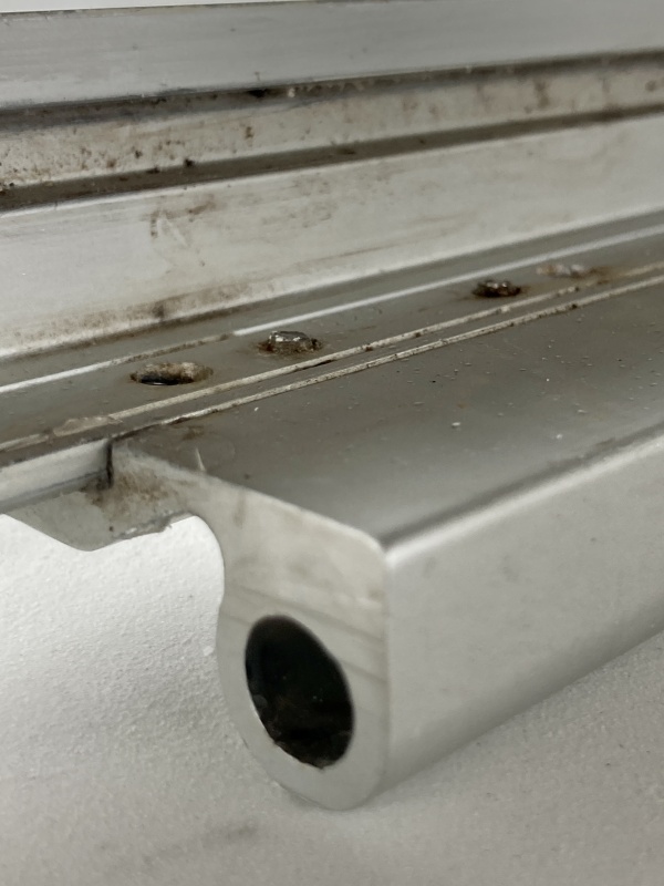 These machine screws should really be flush so I can compress the butyl tape without the frame bottoming out so I carefully filed 
them down.