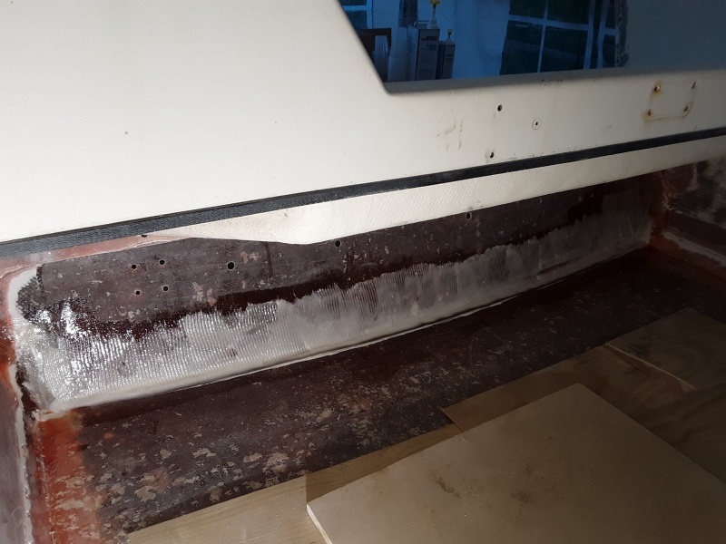 thickened epoxy troweled on and a thick bead along the bottom