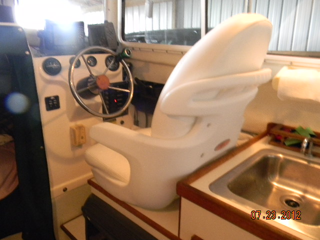 This a Tempress Elite High back Seat. Cost around $200.00  It"s about 2"(The Bottom) highter than the Org. I could not us a swivel  Rides Great