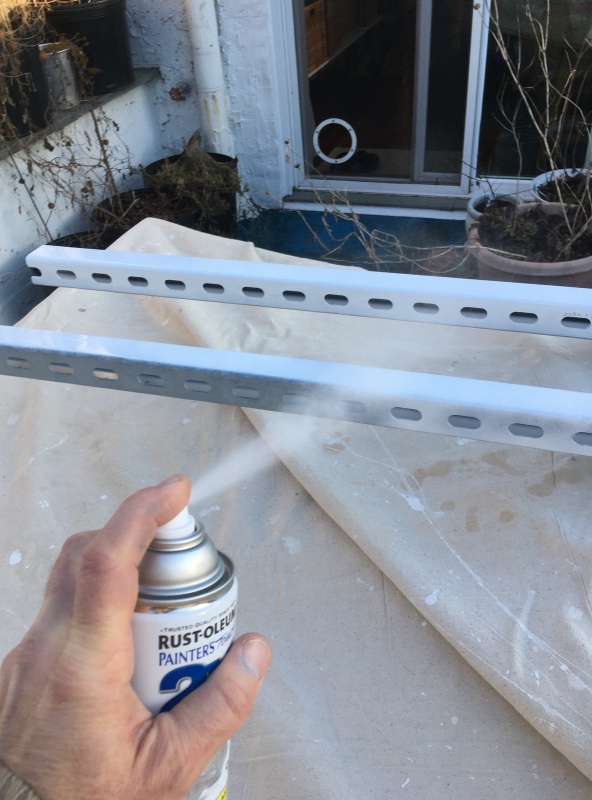 this cheap project came together when I dumpster dove some long lenghts of 12-Gauge Electro-Galvanized Half Slot Steel Strut Channel which I painted white. I don't consider this a permanent fixture on the boat otherwise I would have sourced some sort of aluminium or even SS chanel