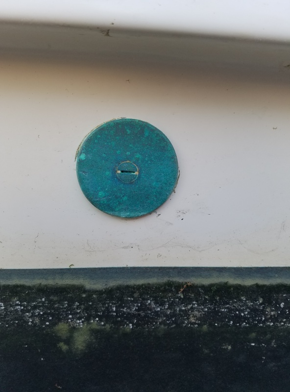 This is a bronze cap I made with a hole saw over an old air conditioning thru-hull I removed, a very easy solution to covering the hole. It has a slightly larger square plate on the inside, the countersunk bolt is silicon bronze. Absolutely don't use brass!! Too much zinc in the alloy and it will suffer from "dezincafacation" in salt water.