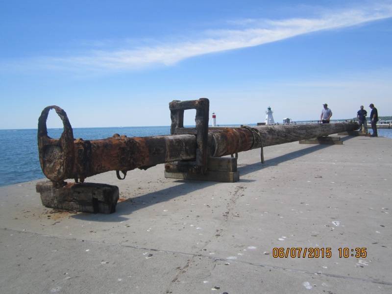 This is the 200 year old mast caught in a fishing net off the tip of Long Point(Lake Erie) in early May 2015. It is 77 feet long - 15 to 20 inches in dia. - solid pine and weighing(waterlogged) between 15 and 20 tons. This is the day it was put back in the water as ordered by the Ontario government.