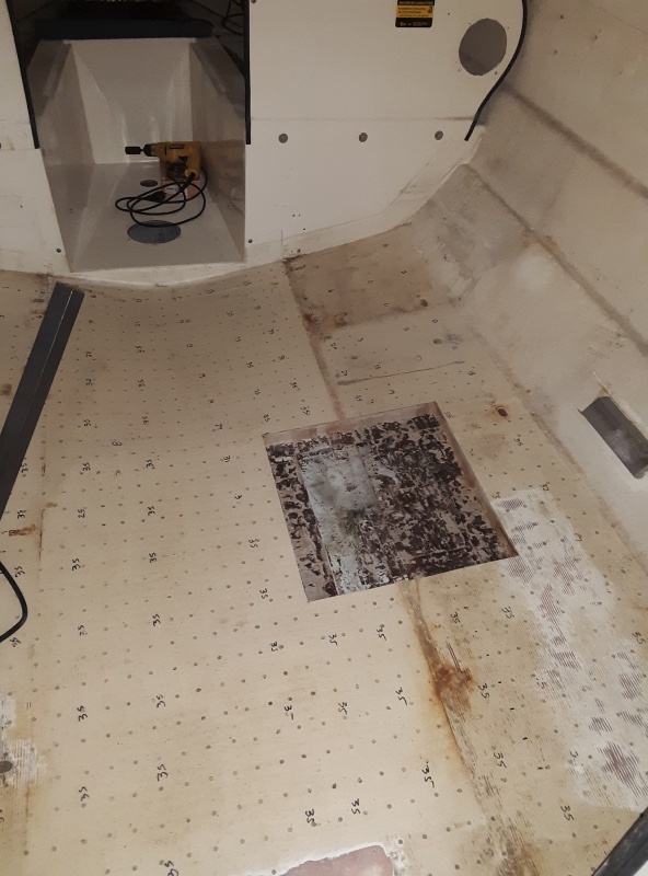 this is the extent of the core removal under the galley.  you can see the void from layup- its the lighter area