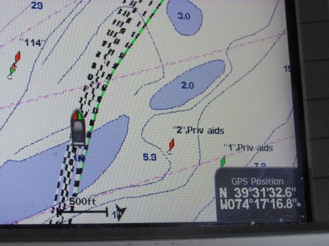 this picture taken almost at the same time as the previous shows the two cans shown to the right of our boats Icon well out our course and in fact in the position they are shown they are on top of a shallow sand bar. This is an expensive upscale Blue Chart G2 Vision chip