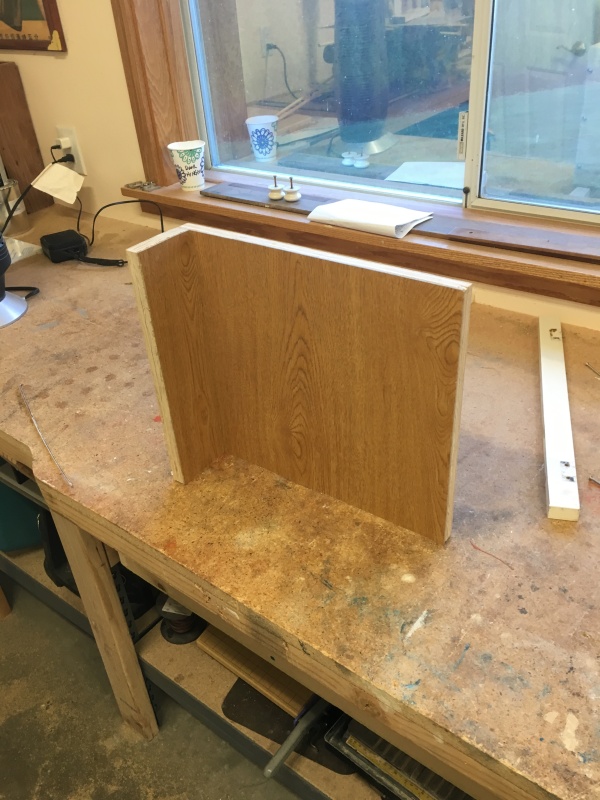 This piece goes aft of the new helm chair.