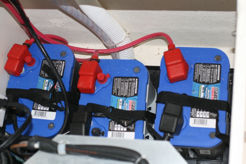 Three batteries (installed by the dealer) two starting batteries (34M Optima) and one 'house' battery (D34M Optima) located beneath the port forward dinette seat - behind the refrigerator.