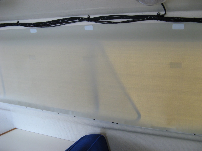 Three tabs at top to hold up large window shade when rolled