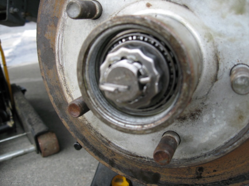 Tighten the wheel bold tells it?s good and snug, than back it off about 1/8th to 1/4th turn.
Install lock ring and a new cotter pin.
