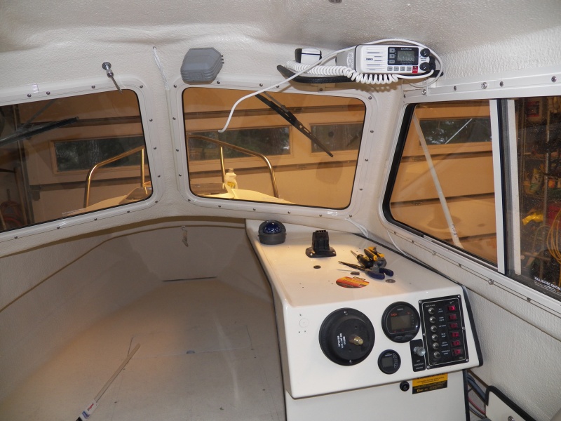 To the left of the helm I'm putting in a regular fuel gauge connected to the tank sender.  The fuel management system recommended still having a regular gauge.  I have marked out the center of the hole for the gauge.  Now I need to find my 2" hole saw again.