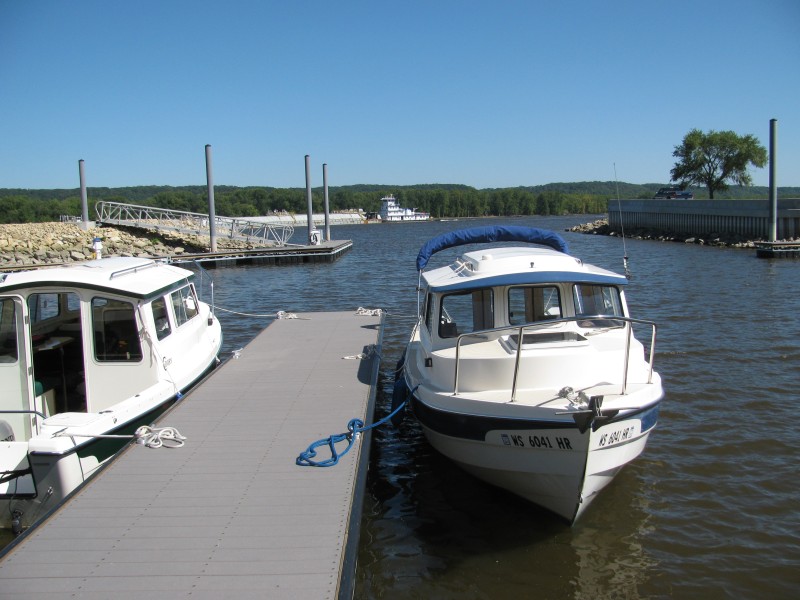 Tow barge passing marina