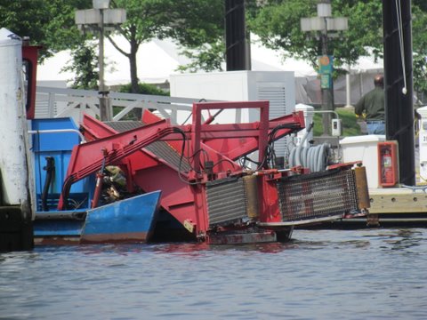 Trash skimmer in Baltimore Harbor