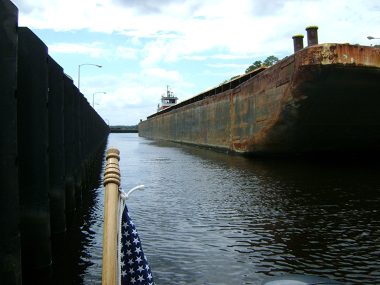Tug Lorette and barge in lock with us