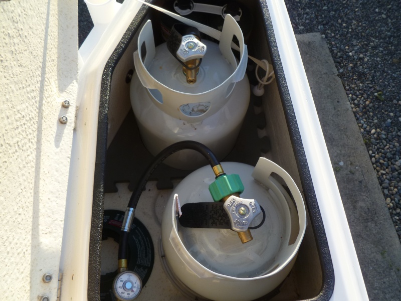 two tanks fit nicely in the old style lazerets, fumes drain out through hull
