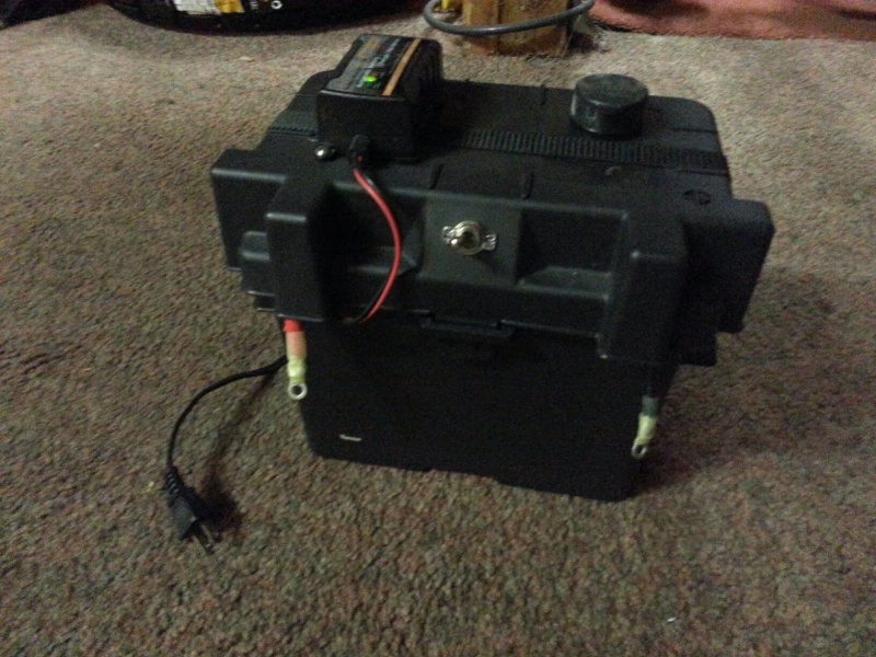 U1 size AGM with charger, 12v port, meter, and switched leads for alligator clamps.  We use this for charging RC gear.