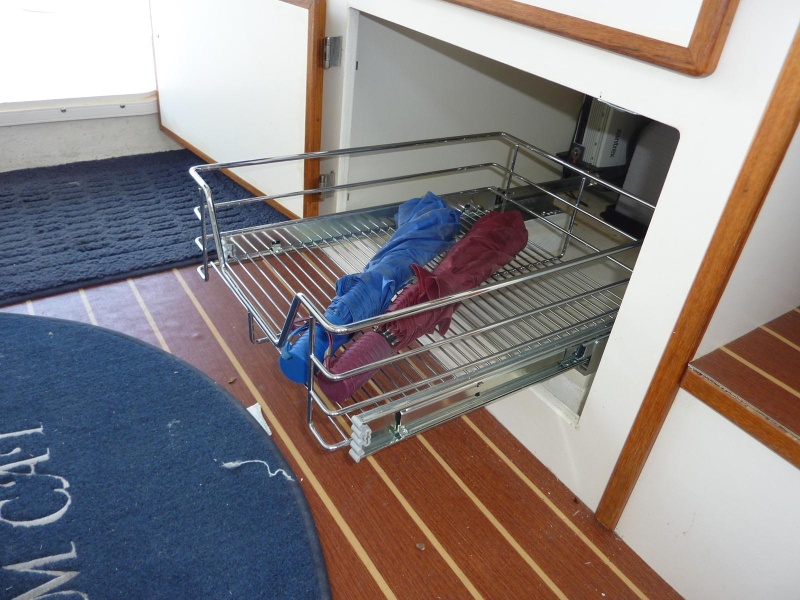 Under dinette seat pull out storage.  Area along sides used for taller items.