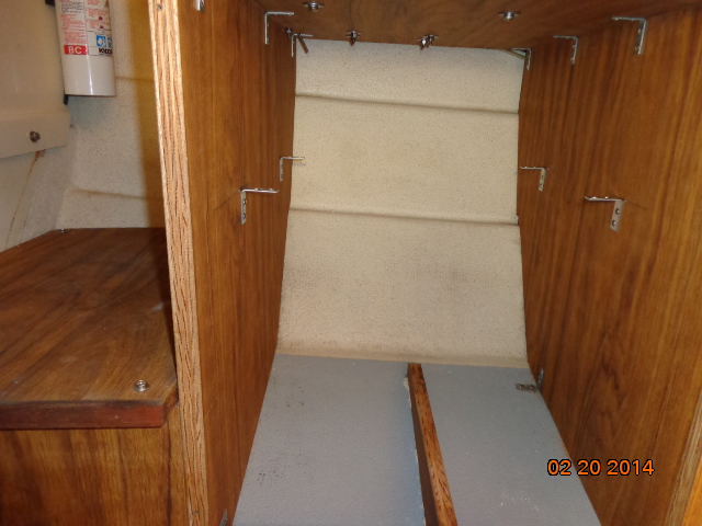 Under the helm seat was this storage area originally filled by an ice box of sorts. See next photo.