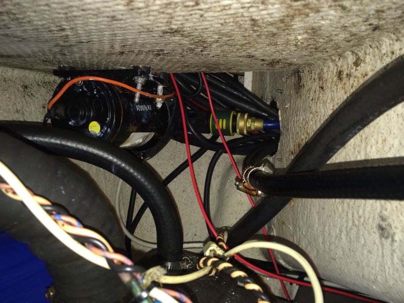 underside of starboard hatch mounted washdown pump just above gas tanks still have a few wires to reattach but should work well