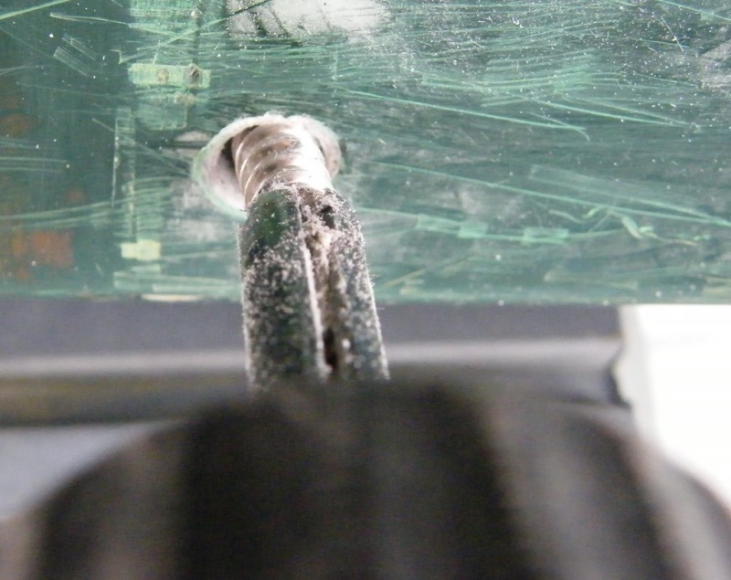 "Unscrew-Um" backing broken screw out of mounting hole.