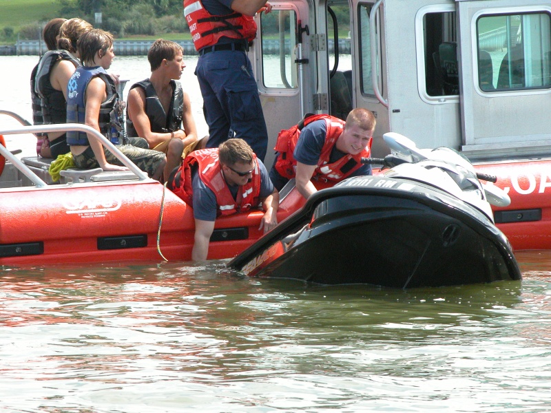 USCG Station Little Creek responds. Within minutes of this pix, CG receives emergency call- transferring the 4 teens to Sea Angel before Va. Beach Fireboat #1 arrives.