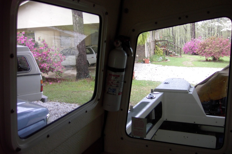 Use lower screw in outside grab rail to hold Fire extinguisher mount here. No new holes.