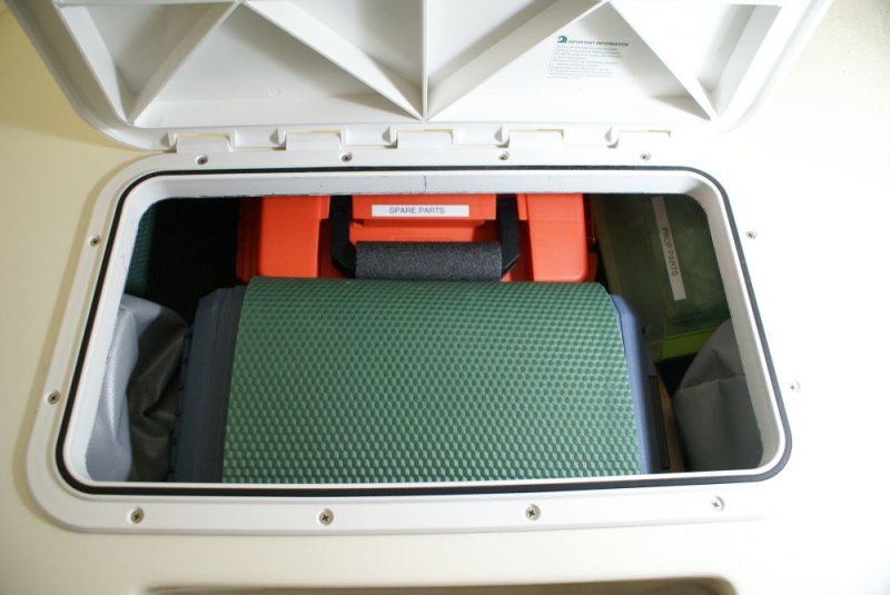 V-Berth Storage Install -DSC06195 A left over piece of foam pad was perfect for helping to keep things snug and quiet.