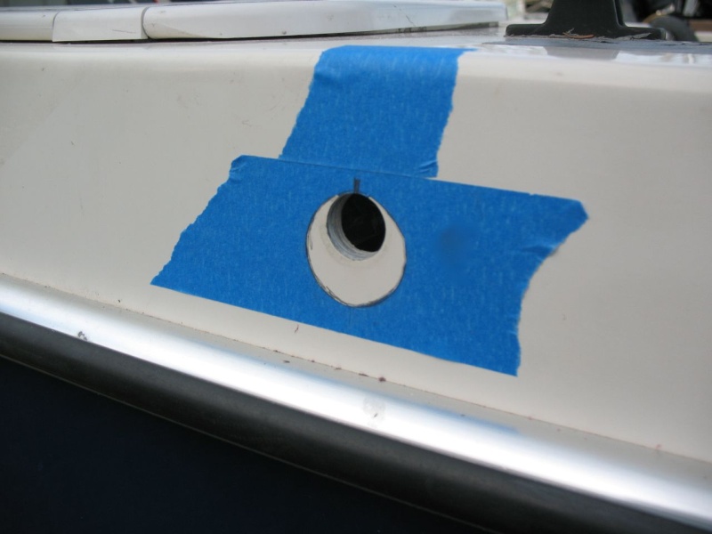 Vent new hole marked.  In order for the P-trap to fit under the side deck, the new 1-3/8" hole had to be as low as possible (of course while also encompassing the old 3/4" hole).