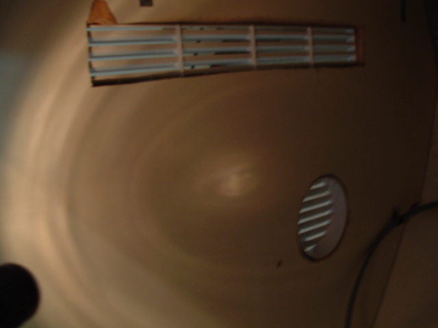 Vents located under the helm.  one is 15" by 2" the hole is 4" in diameter.  The top vent is located next to the compressor fan (exhaust side).