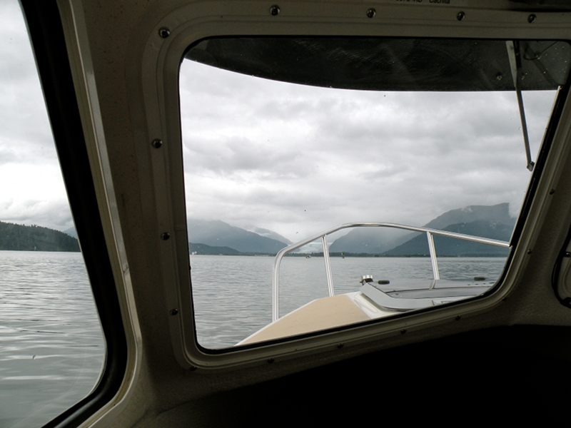 View of Mendenhall Bar entrance with boat pulling crab pots at green marker 19A.