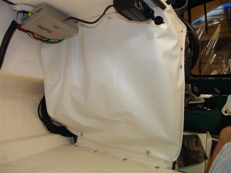 Vinyl with trim and snaps. Got the idea from a bigger C-Dory.
