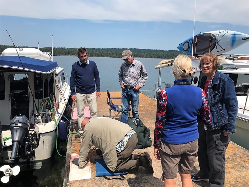 Watching Tom filet a Lake Trout!