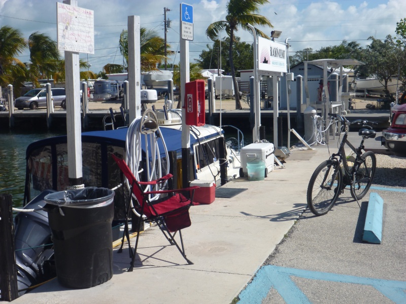 We turned our slip area into a ghetto with bicycles coolers grill. I used our induction cooker on the fish table which was equipped with an 120 volt outlet. Free ice over at the gray building in the backround