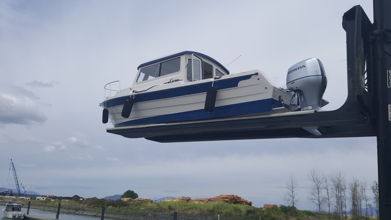 What a beautiful boat.  Brock says the color is \"Oxford Blue\"