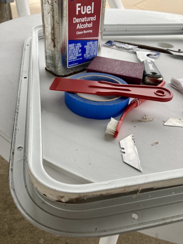 While the balsa was airing out and I waited for an order of epoxy I set to clean all the caulk residue from the hatch frame .
