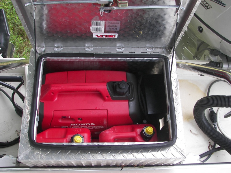 Without cutting openings, the box will hold a Honda i2000 and four, one gallon fuel tanks. I know about and have an extended run tank, but this works better for me now. You have to put the genset in exhaust first, vertically, then slide it to the left and drop front end down. This does not seem to spill oil, although sideways tilting will.