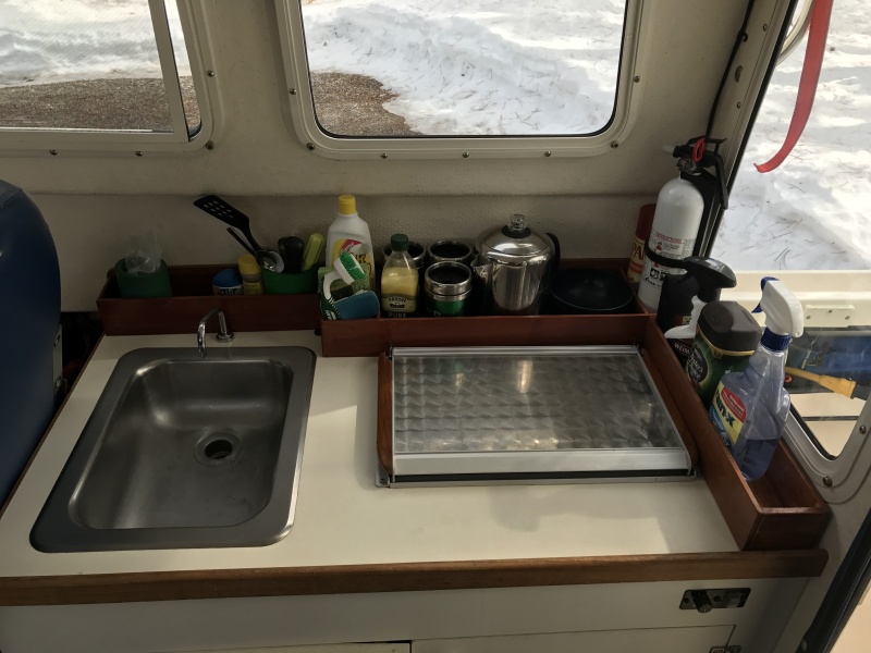Wood storage racks on galley counter top