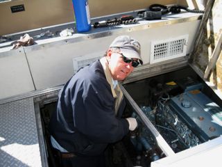 working on one of the cruiseboat engines