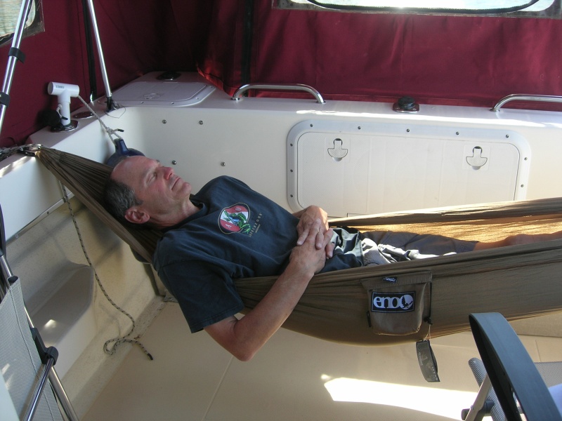Yep, an ENO ProNest hammock strung between the 2 stern cleats - which have strong backing plates.  I'm 5'8" tall (or short) and fit fine.