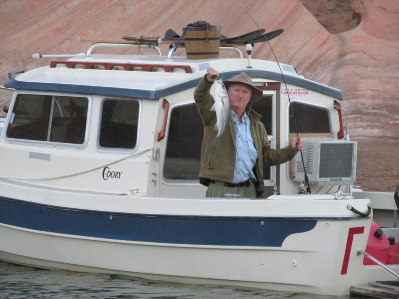 Yes! Tex catches a nice size fish. Notice ice cream maker on top of cabin.