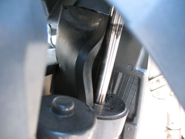 You can see a "slot" cast into the boat side of the motor mount toward the upper right. There is one of these each side and my new "wedge" fits into them.